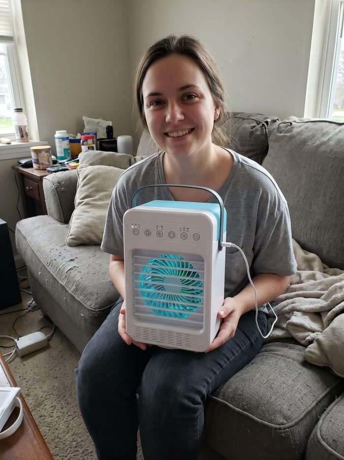Rachel holding her CoolJet at her desk